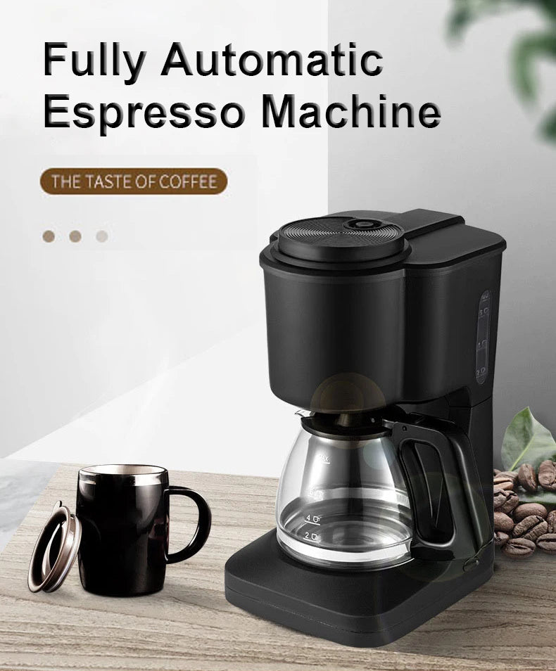 Compact black automatic coffee maker with glass carafe and matching mug on a wooden table.