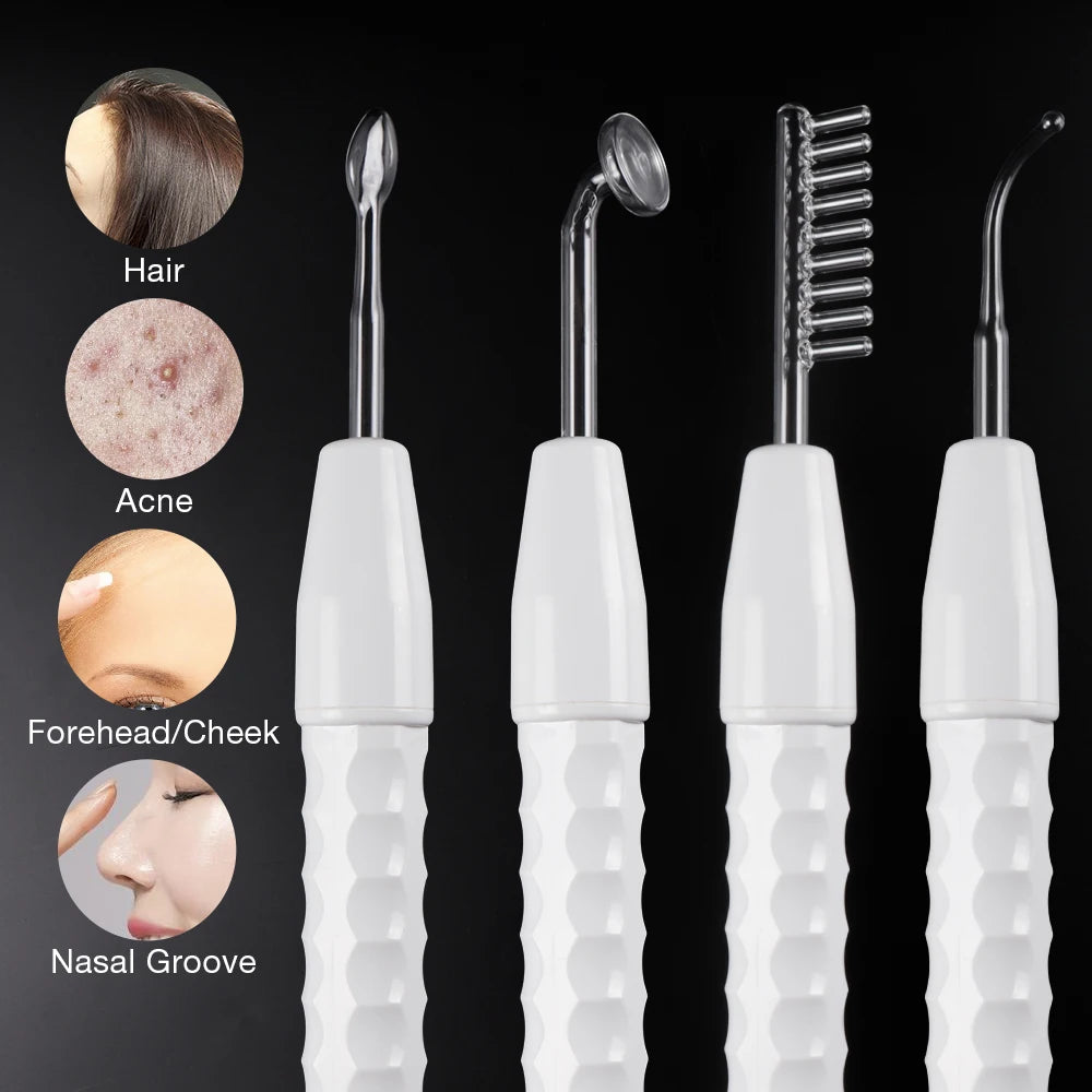 Four white-handled high-frequency facial wands with various glass electrodes for hair and skin treatment.