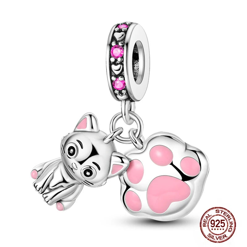 925 sterling silver charm featuring a cute kitten and pink enamel paw print for charm bracelets.