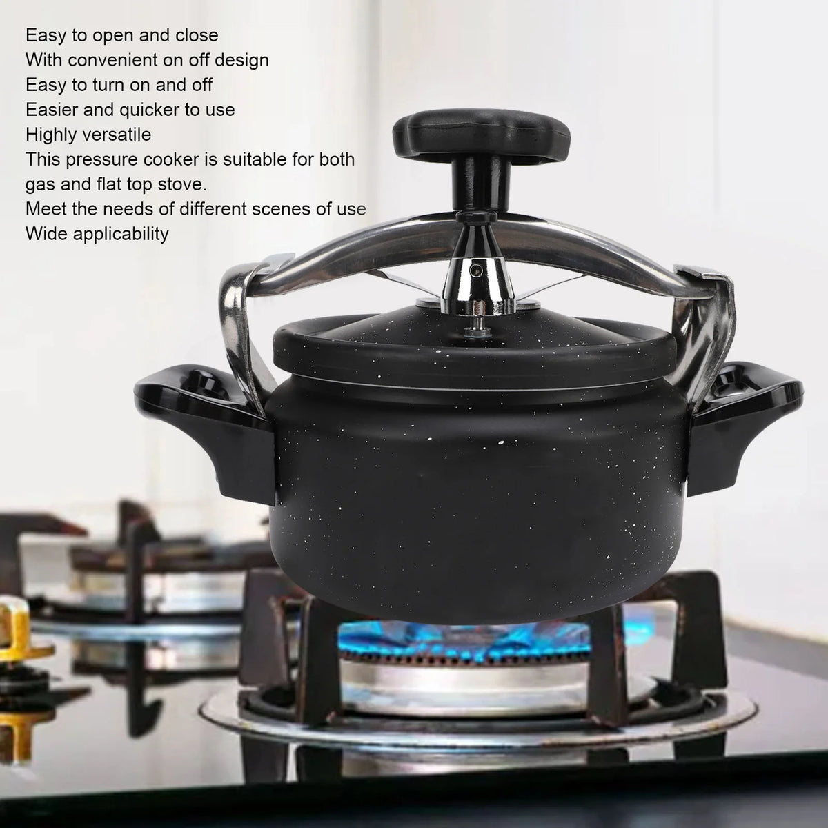 Black speckled pressure cooker with lid and top knob on a stovetop