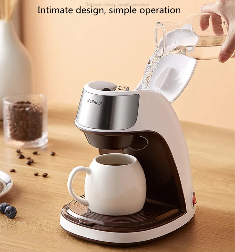 KONKA compact white and brown single-serve coffee maker brewing into a mug, filling water into the top reservoir.