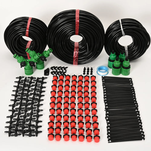 Drip irrigation watering kit with black tubing, red drippers, green connectors, and stakes