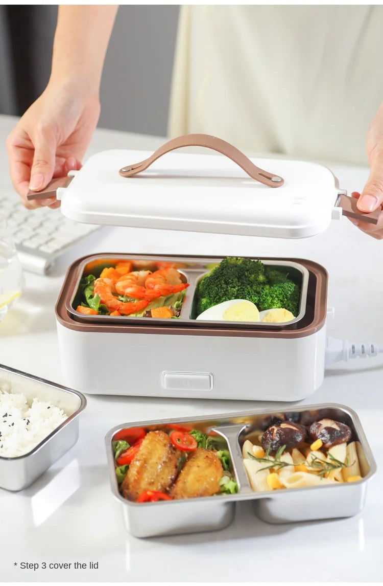 Portable electric heating lunch box with lid open and food in inner compartments