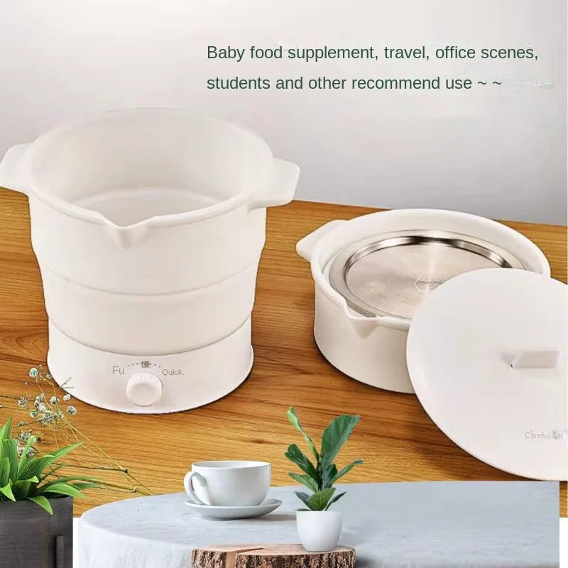 White foldable electric baby food warmer pot on a table with a small cup