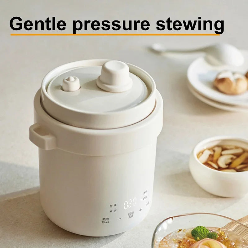 White mini electric stew cooker with round lid and steam valve detail