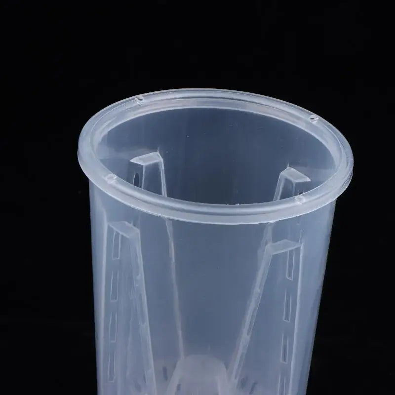 Close-up of clear plastic planter with wide rim and inner support channels