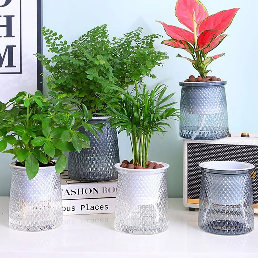 Self-watering plant pots, textured gray and white plastic planters with water reservoir lids