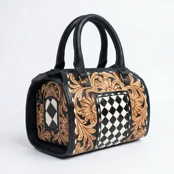 Genuine leather trunk bag with floral tooling, black and white checkerboard print, and secure zipper closure.