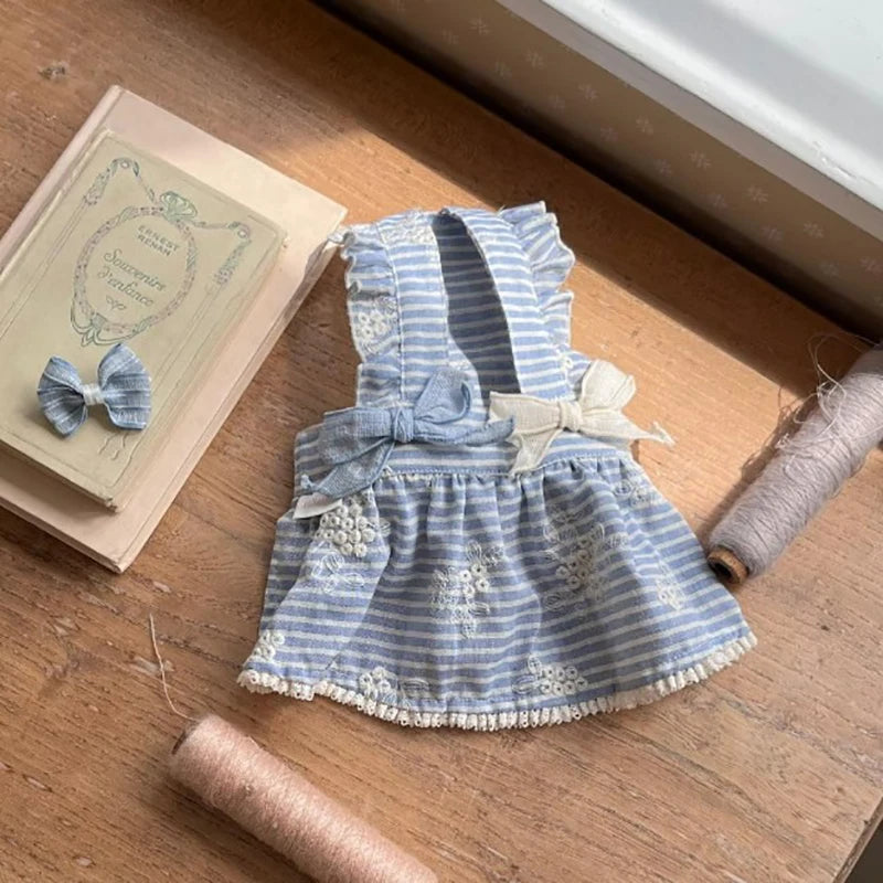 Cute blue striped dog dress with floral embroidery and bows for small to medium pets, perfect for spring and summer.