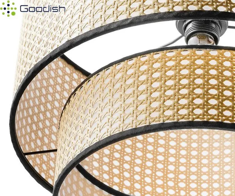 Two-tier woven rattan drum lampshade with black trim, designed for hanging pendant lighting fixtures.