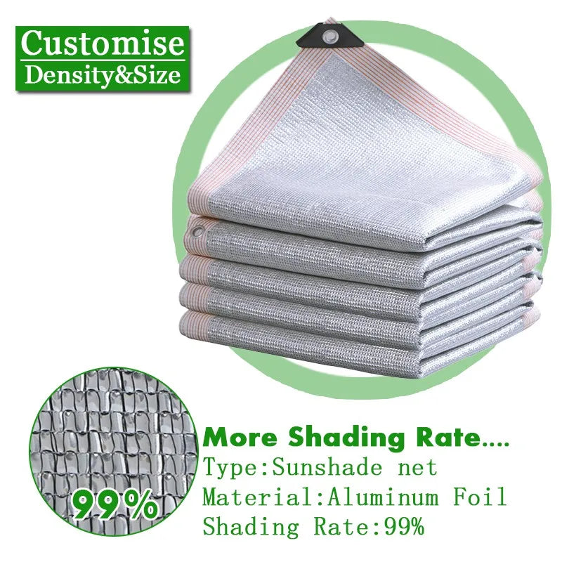 Silvery aluminum foil sunshade net, folded with grommets; 99% shading rate.