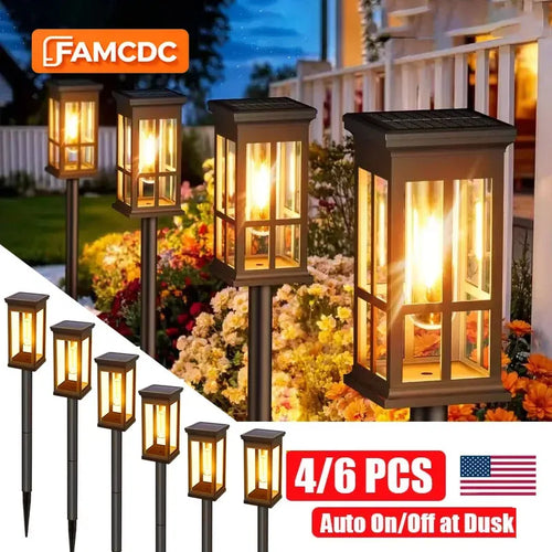 Solar pathway lights set with black stakes and lantern housings, warm glow