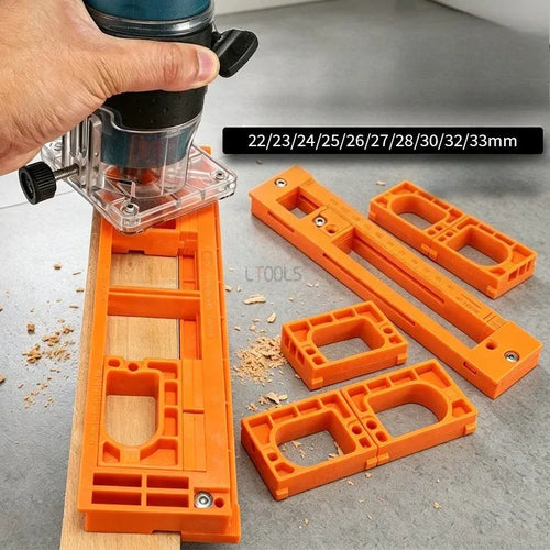Orange hinge routing jig set with template inserts and hand-held router milling base