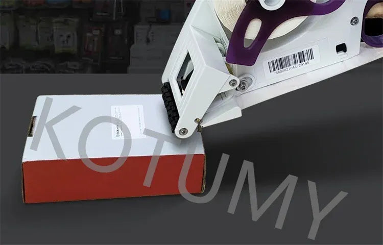 Handheld labeling machine applying a label to a flat box surface