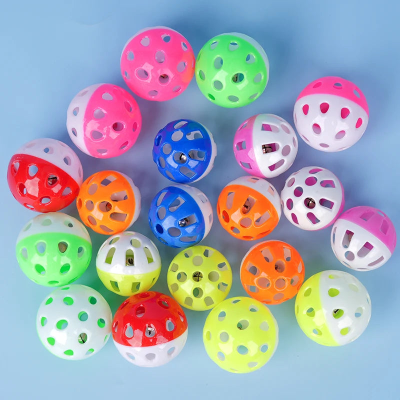 10 colorful hollow bell balls for parrots and parakeets. Engaging chew toy set for bird cage exercise and entertainment.