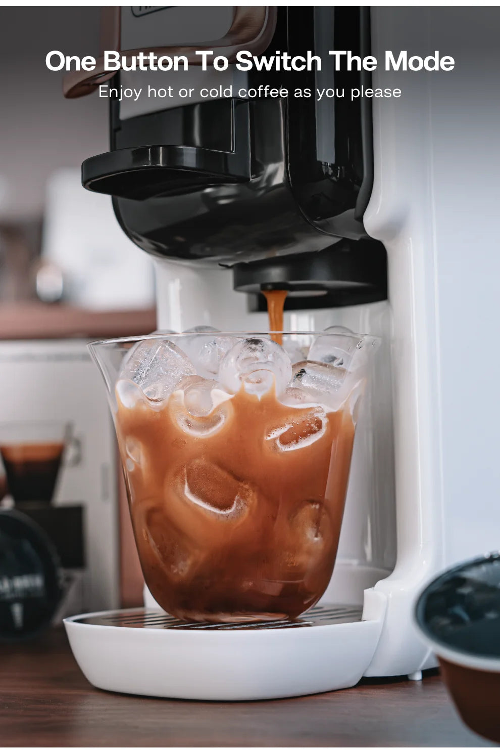 White coffee maker brewing iced coffee into a glass cup with text overlay about hot and cold brewing modes.