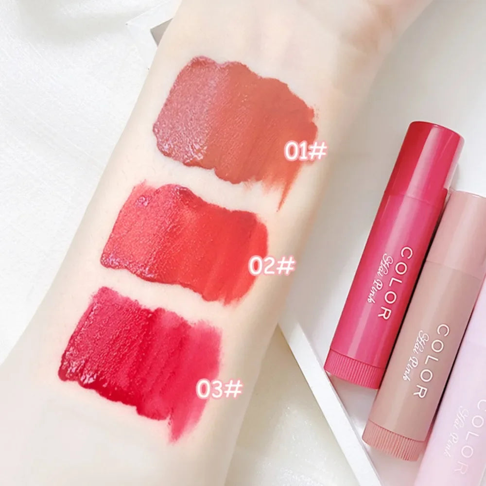 Moisturizing lip balm tint swatches on arm in red, pink, and nude shades with cute lipstick tubes.