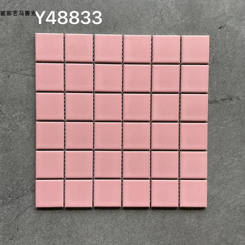 Ceramic mosaic wall tiles sheet with matte light pink squares and dark grout lines