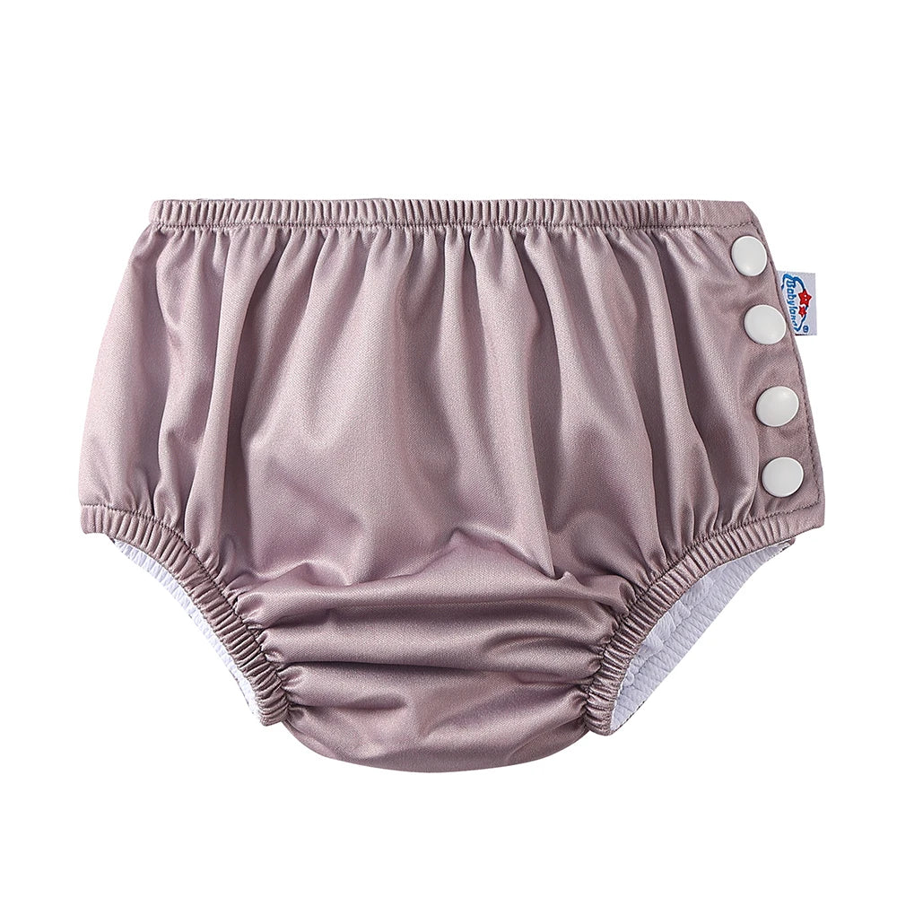 Babyland reusable dusty rose cloth diaper with side snap buttons for adjustable baby care.