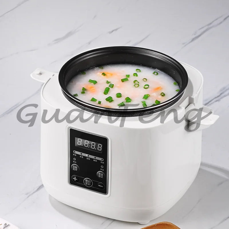 Compact white mini rice cooker with glass lid, digital panel, and vegetable soup
