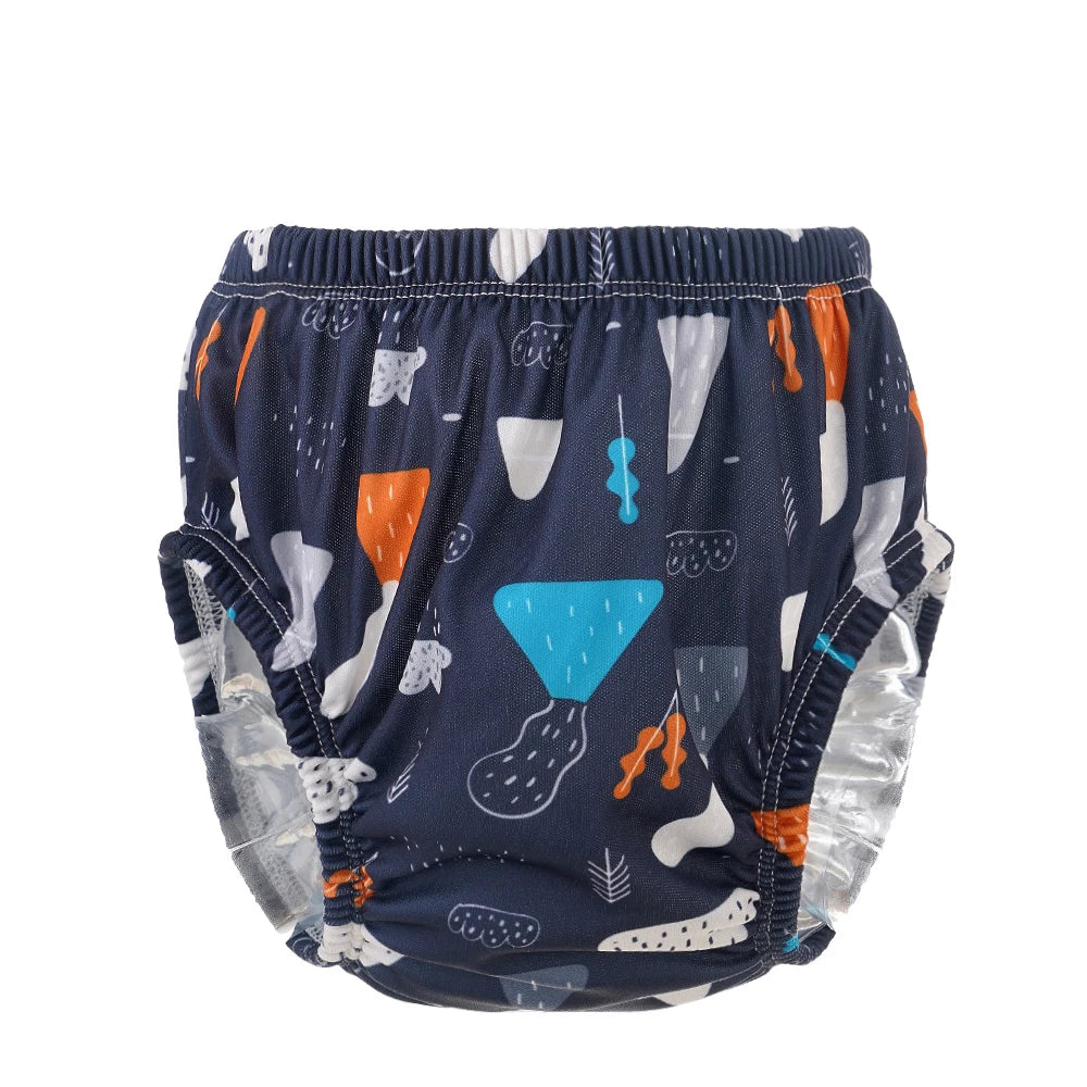 Navy blue baby swim diaper with abstract forest and geometric print, elasticized leg cuffs, premium baby care product.