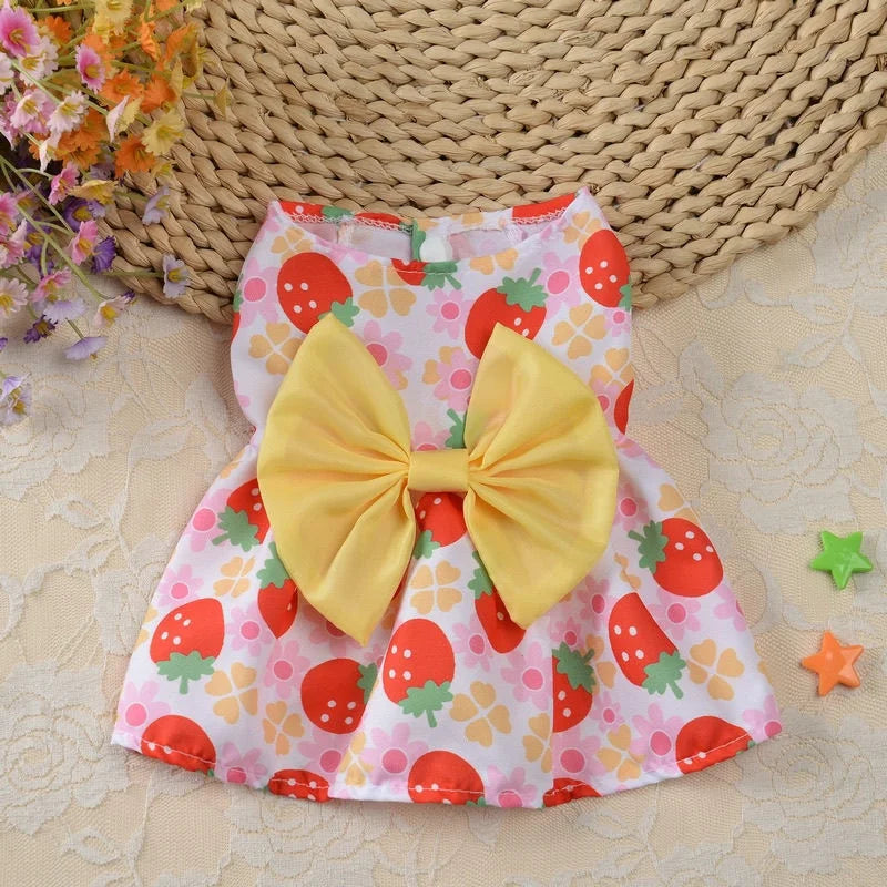 Cute strawberry print dog dress with yellow bow for small puppies and kittens. Perfect breathable summer pet apparel.