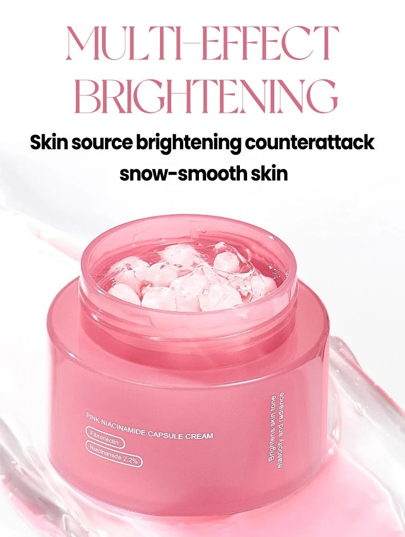 A jar of pink capsule face cream with a clear, jelly-like texture and pink spheres inside on a white background.