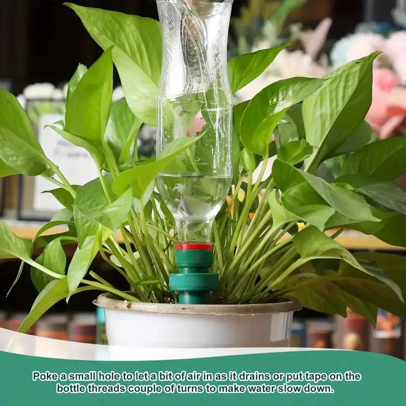 Automatic drip irrigation stake with bottle connector inserted near plants, green and white