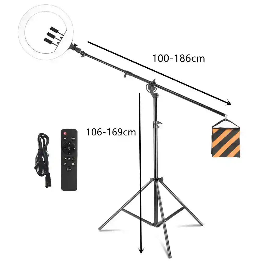Black ring light on an adjustable boom arm tripod stand with a sandbag counterweight, remote, and power cord.