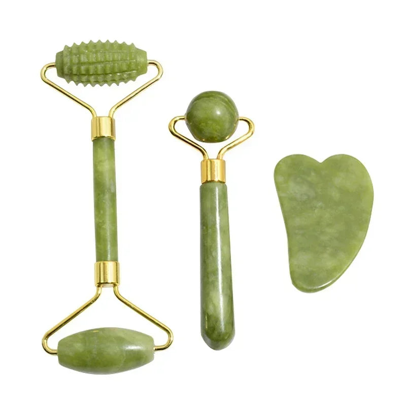 Green jade skincare set with a double-ended roller, a single ball massager, and a heart-shaped gua sha tool.