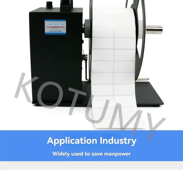 Label rewinder machine with black base, white label roll, and metal drive shaft