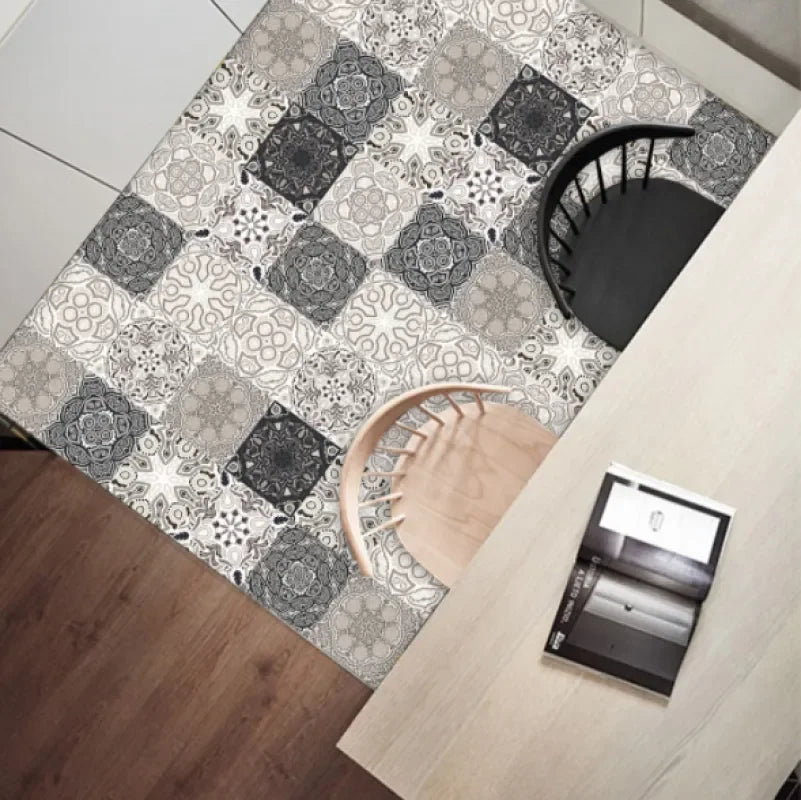 Self-adhesive mosaic tile sticker sheet on floor, gray and white geometric pattern