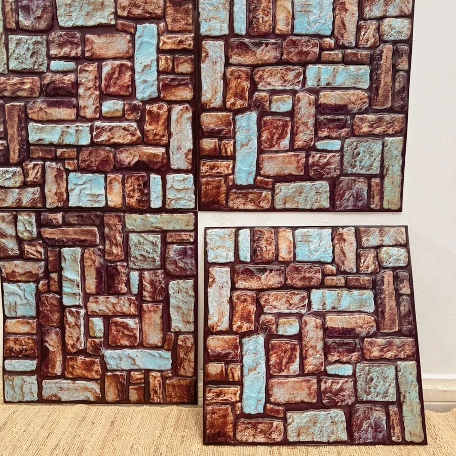 Peel-and-stick backsplash tile sheet with faux brick pattern in red, brown, and blue highlights