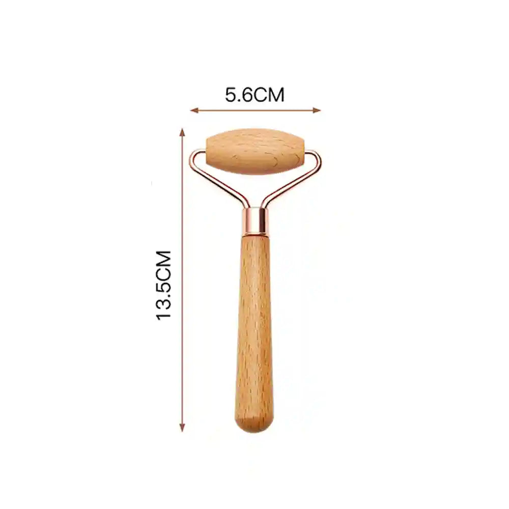 Wooden face massage roller with a rose gold frame, showing dimensions of 5.6cm width and 13.5cm total length.