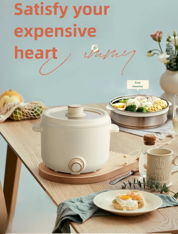 White electric multi cooker with lid and knob, on a kitchen counter for steaming