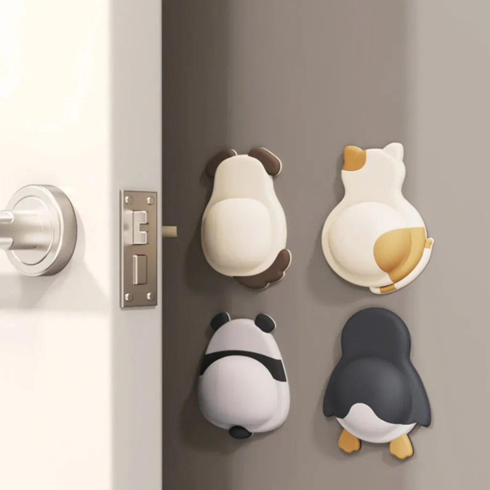 Self-adhesive 3D animal door stoppers (cat, dog, panda, penguin) protect walls from furniture and door handle impact.