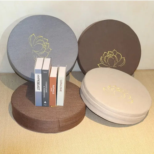 Round fabric meditation cushions in grey, brown, and beige for mindful yoga practice and comfortable zafu seating.