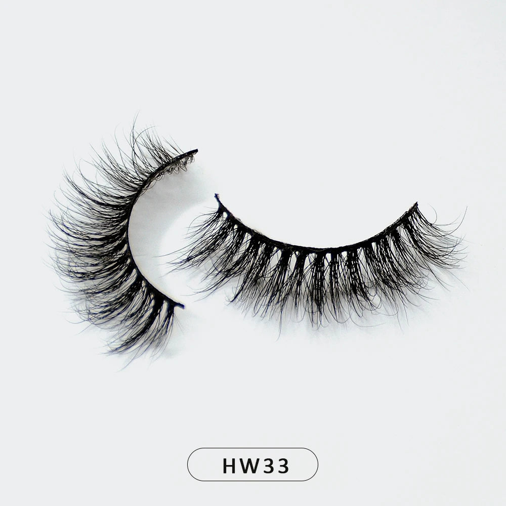 A pair of wispy, black 3D mink false eyelashes with a flexible band, shown against a plain white background.