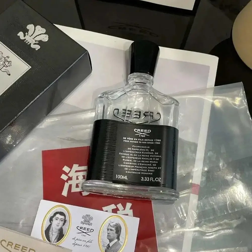 Creed Aventus EDP: Unisex 100ml spray in signature clear glass bottle with black label. Luxury niche fragrance.