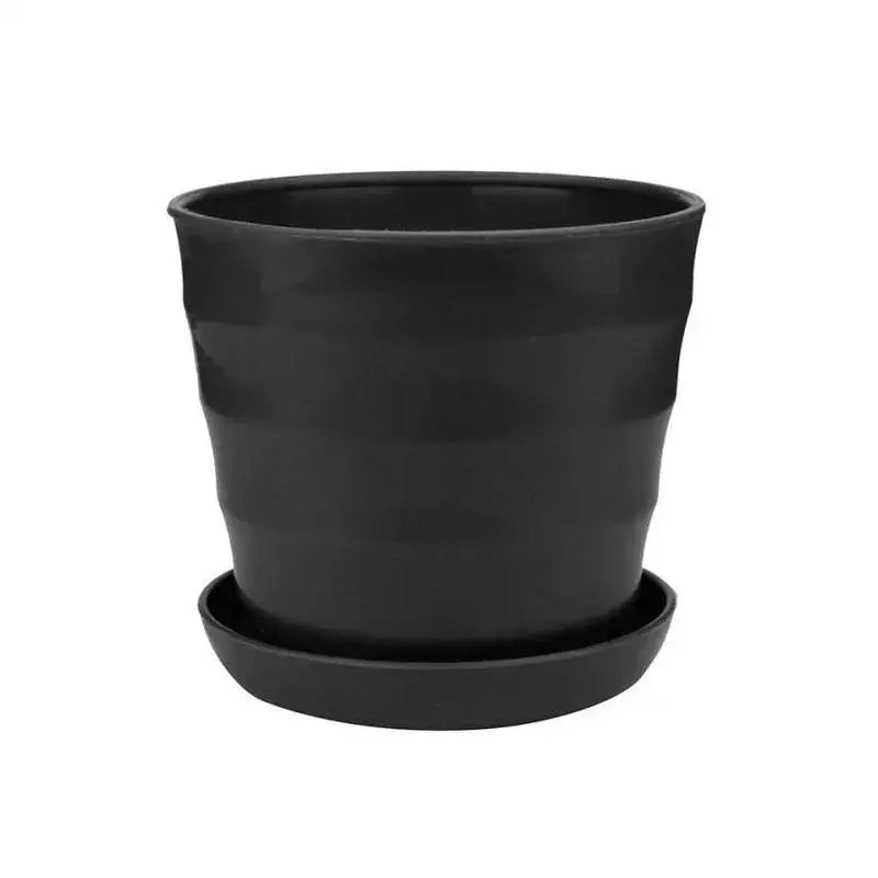 Black plastic flower pot with matching saucer, matte finish