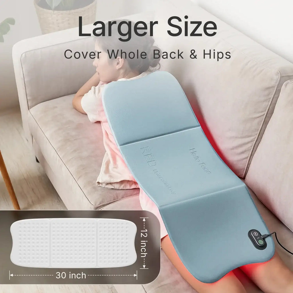 Large, blue Hello Face LED red light therapy mat for body pain relief, shown on a person’s back and hips.