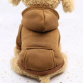 Small dog wearing a cozy, thick brown hooded sweater for warmth during autumn and winter.