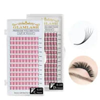 Two trays of black premade volume eyelash fans on pink adhesive strips, used for professional lash extensions.