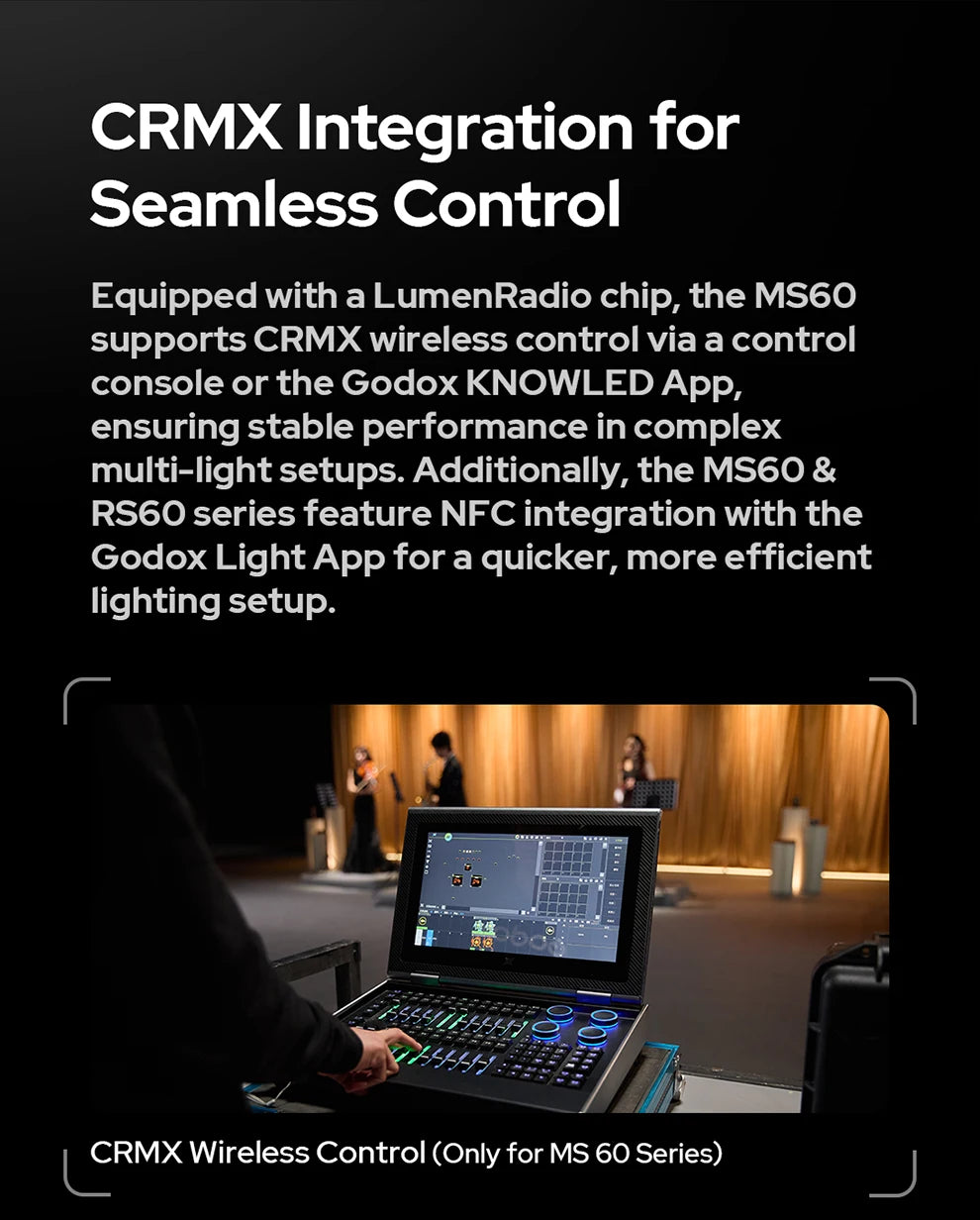 A technician uses a black wireless lighting control console with a screen and illuminated dials to manage studio lights.
