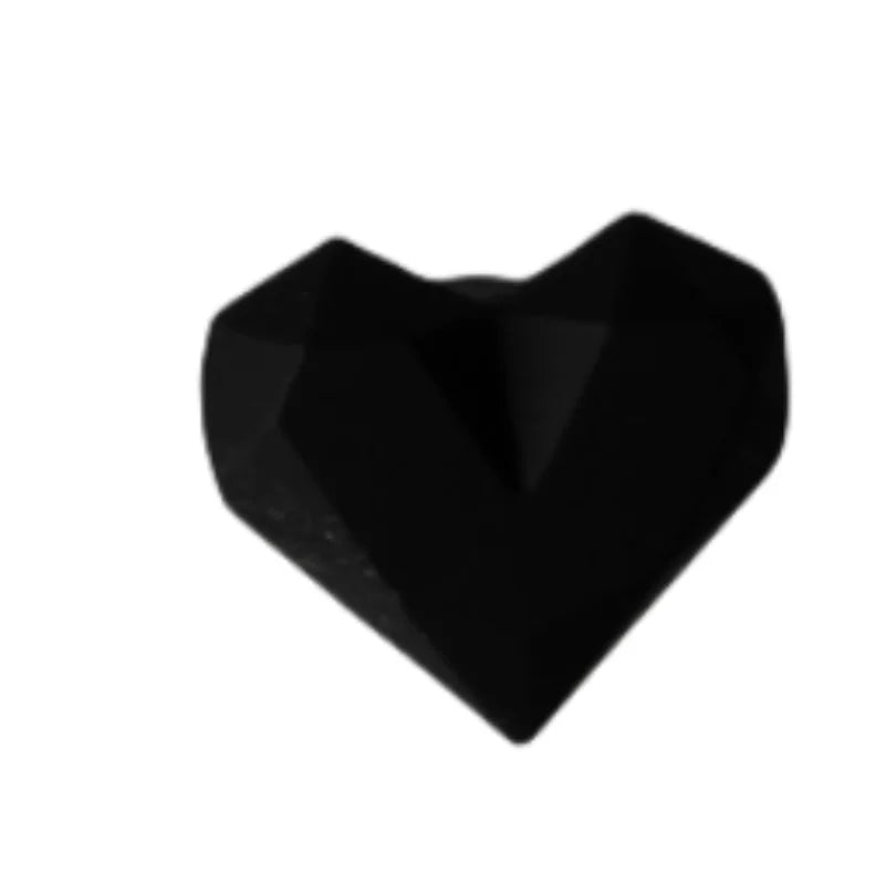 Black heart-shaped silicone dust plug for Tamagotchi Uni, perfect to protect charging ports from dust and debris.