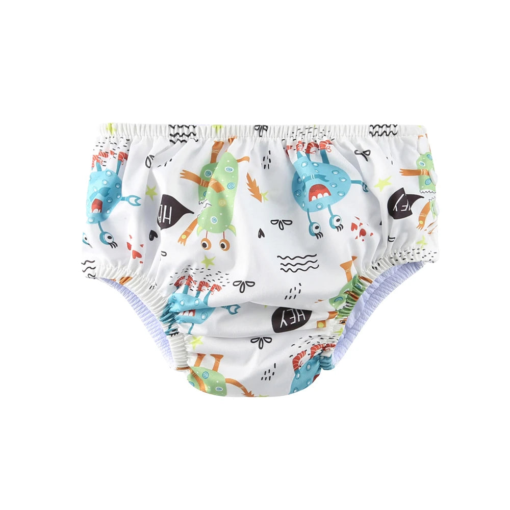 Reusable baby swim diaper with colorful monster print pattern. Comfortable waterproof baby care for summer pool play.