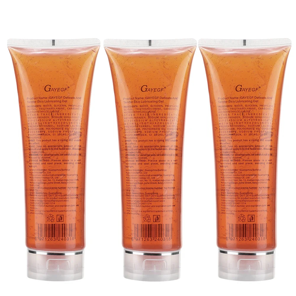 Three tubes of amber-colored delicate skin lubricating gel with clear squeeze tops, displayed side by side.