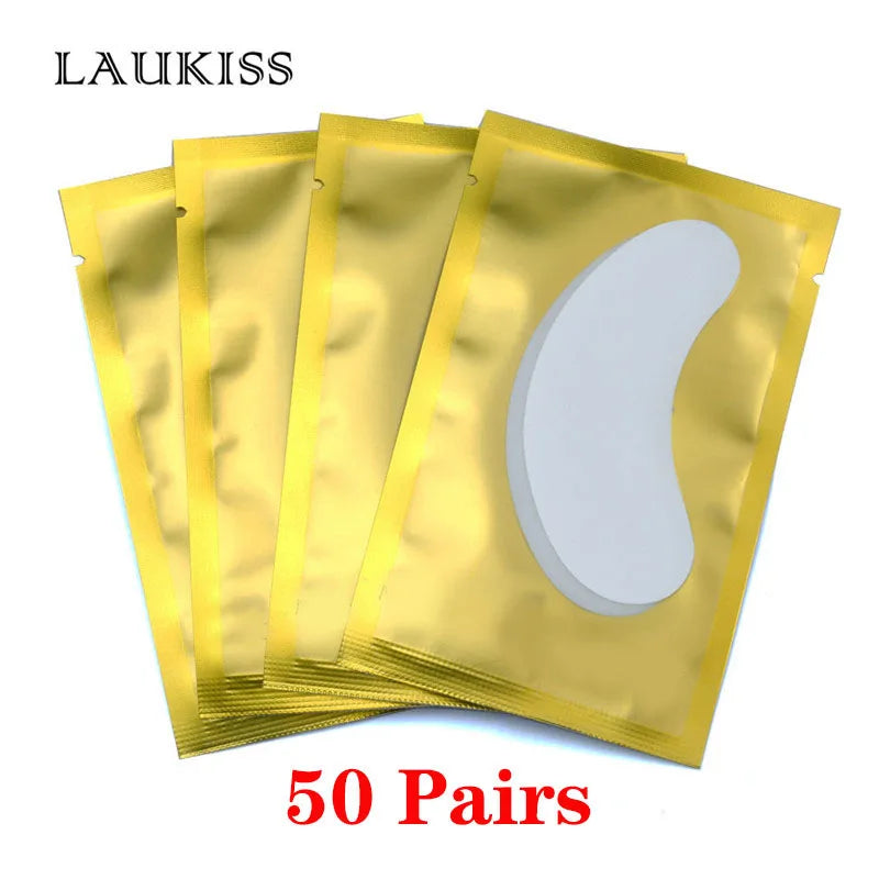 Gold foil packs of white lint-free under-eye gel patches for eyelash extensions and lash lift application.