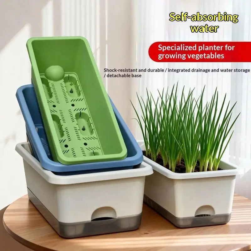 Green and blue self-watering planter box set with separate inner base and drainage holes