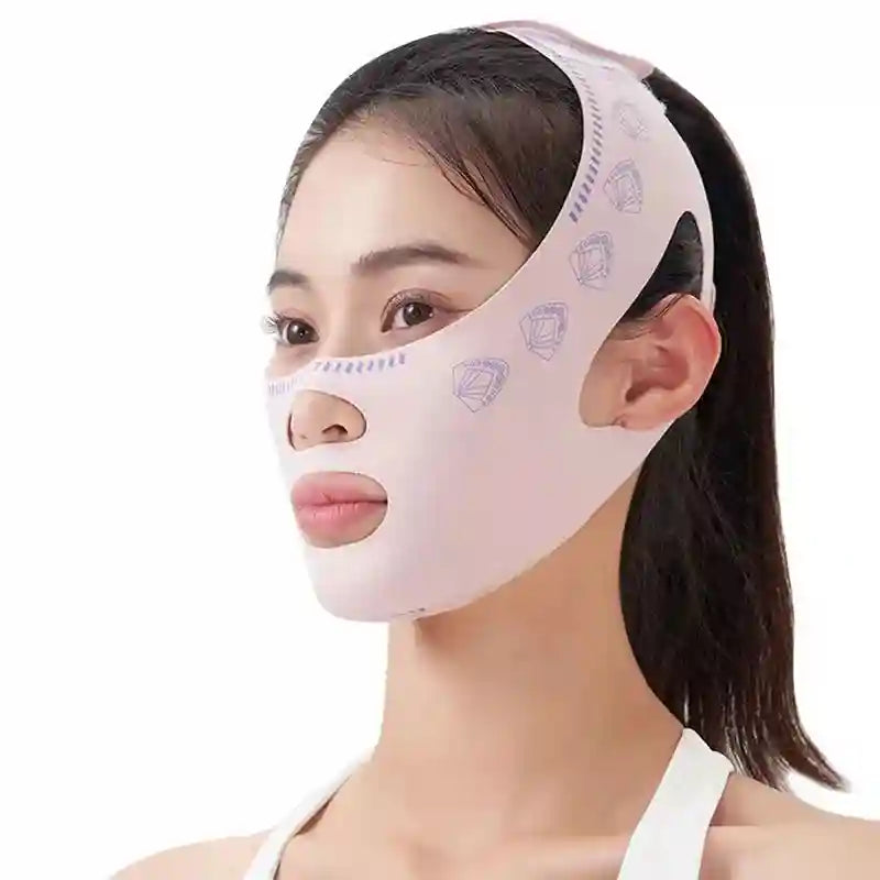 A person wearing a pale pink V-line face sculpting bandage with a subtle fan pattern, covering cheeks, chin, and neck.